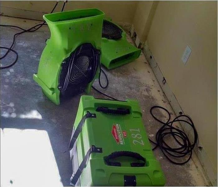 Drying equipment set up in a Deerfield Beach home to dry the floor