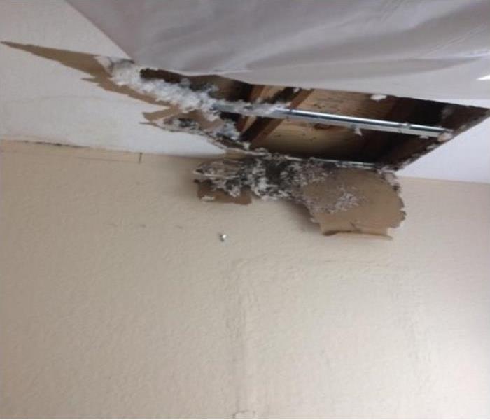 Ceiling damage from a water leak in a Deerfield Beach, FL home.