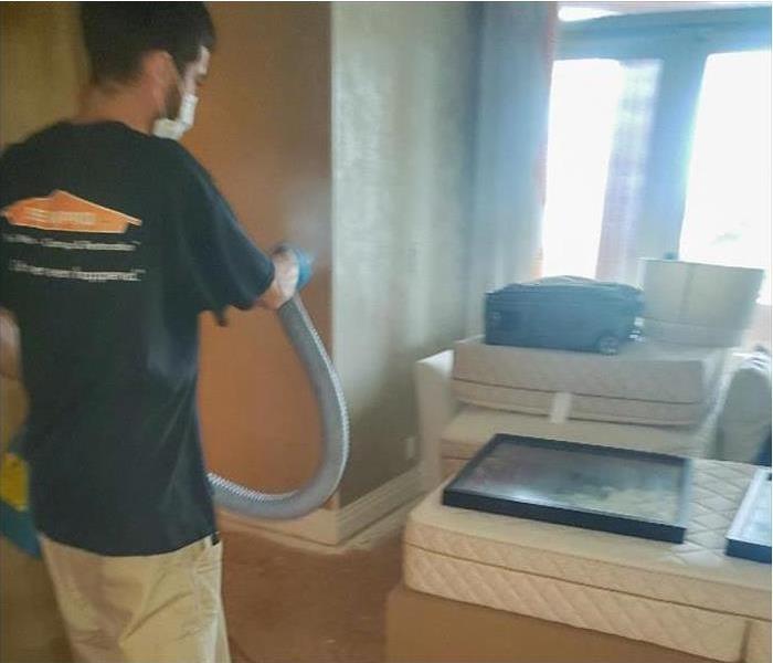 A specialist is cleaning a home