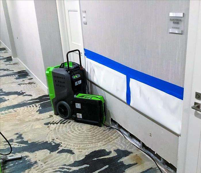 Air movers set up in the hallway of a Deerfield Beach, FL hotel